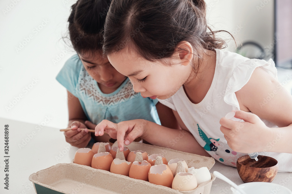 multiethnic young children planting seedlings in reuse eggshells, montessori homeschool education